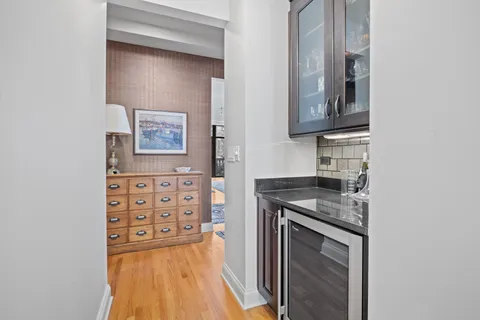 a kitchen with granite countertop a sink and a stove top oven