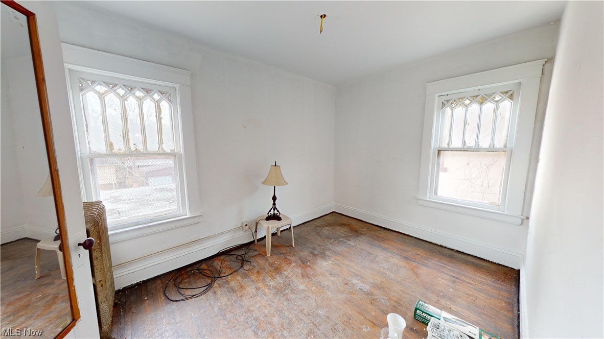 1084 Parkside Road Cleveland, OH 44108 - Photo 12 of 30 Empty room featuring dark wood-type flooring