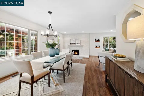 a view of a dining room with furniture window and outside view