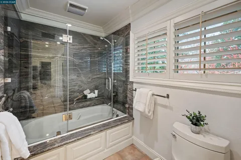 a bathroom with a shower and a bathtub