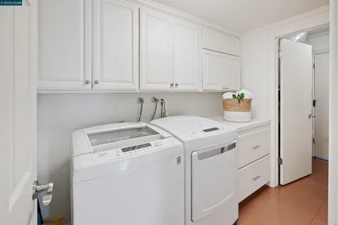 a view of house with a yard and wooden fence