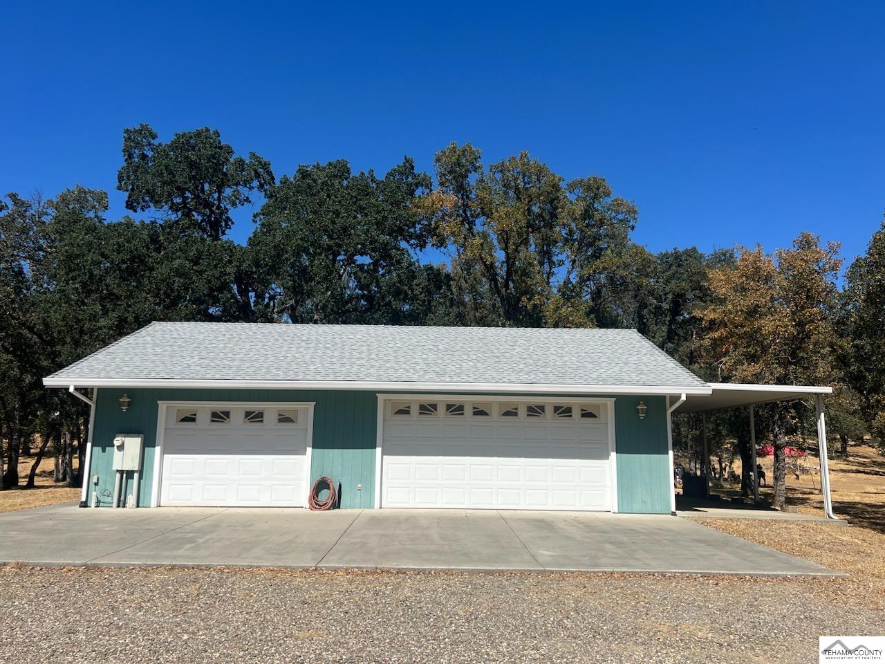 19740 Reeds Creek Road Red Bluff, CA 96080 - Photo 11 of 51 a front view of a house with a yard and garage