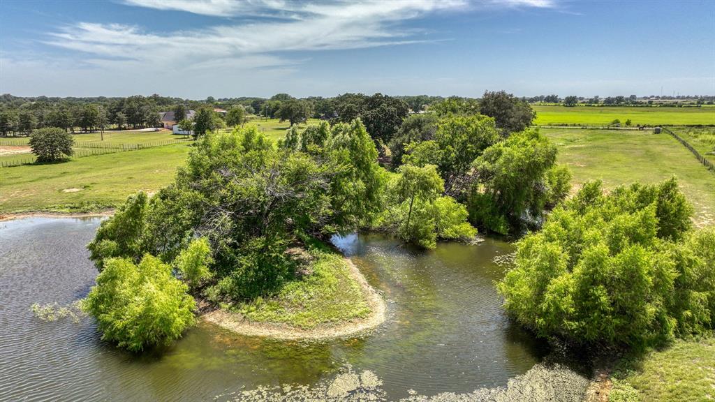 2701 Powell Cemetery Road Tolar, TX 76476 - Photo 13 of 18 a view of a lake with a mountain