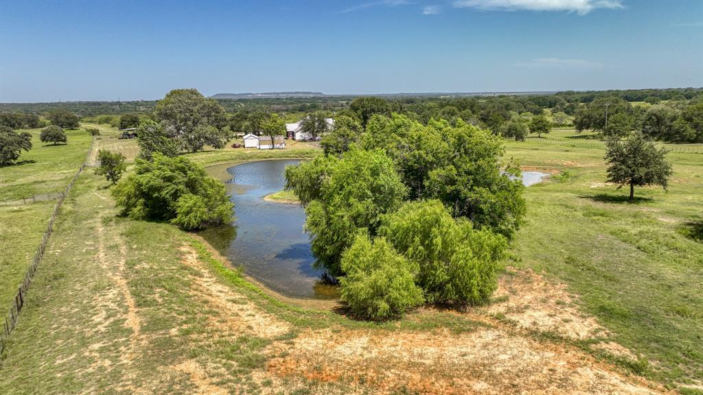 2701 Powell Cemetery Road Tolar, TX 76476 - Photo 14 of 18 a view of a lake with a yard