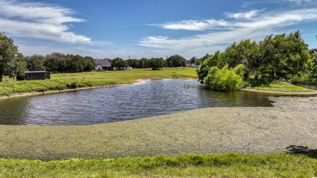 2701 Powell Cemetery Road Tolar, TX 76476 - Photo 7 of 18 a view of a lake with a yard