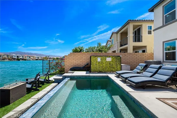 a view of a lake with furniture