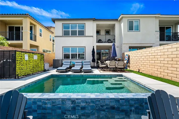 a kitchen with stainless steel appliances kitchen island a sink a stove and a refrigerator