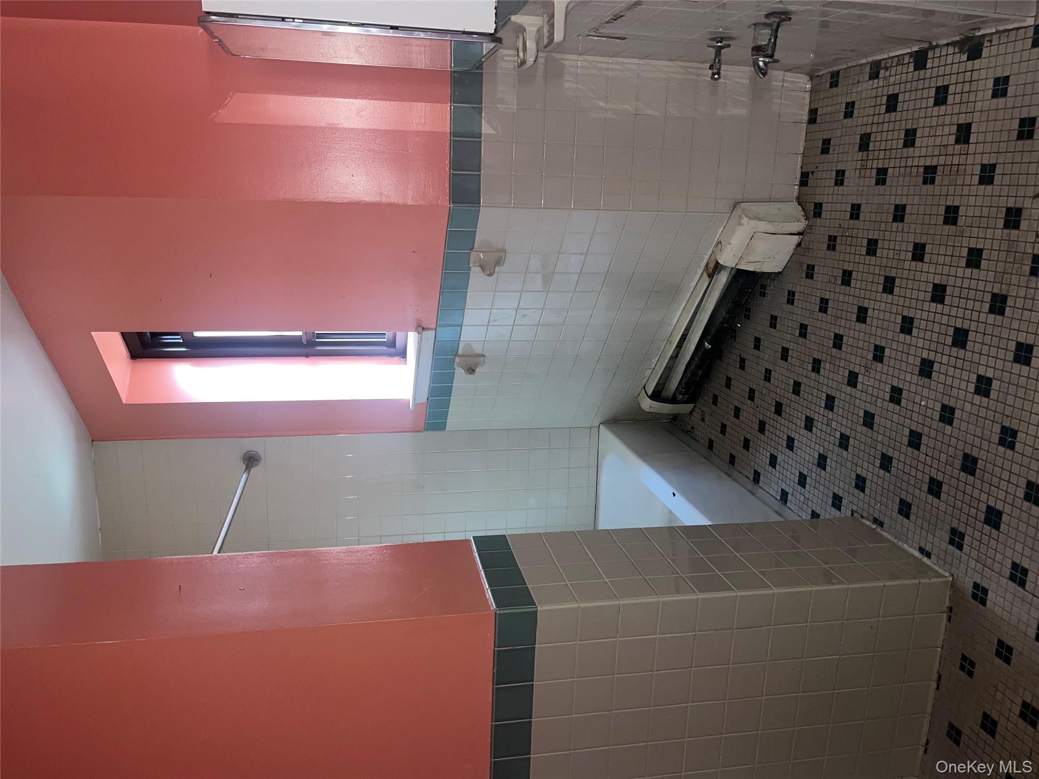 18 East 132nd Street, Unit 3A Manhattan, NY 10037 - Photo 11 of 11 a bathroom with a sink a toilet a mirror and vanity