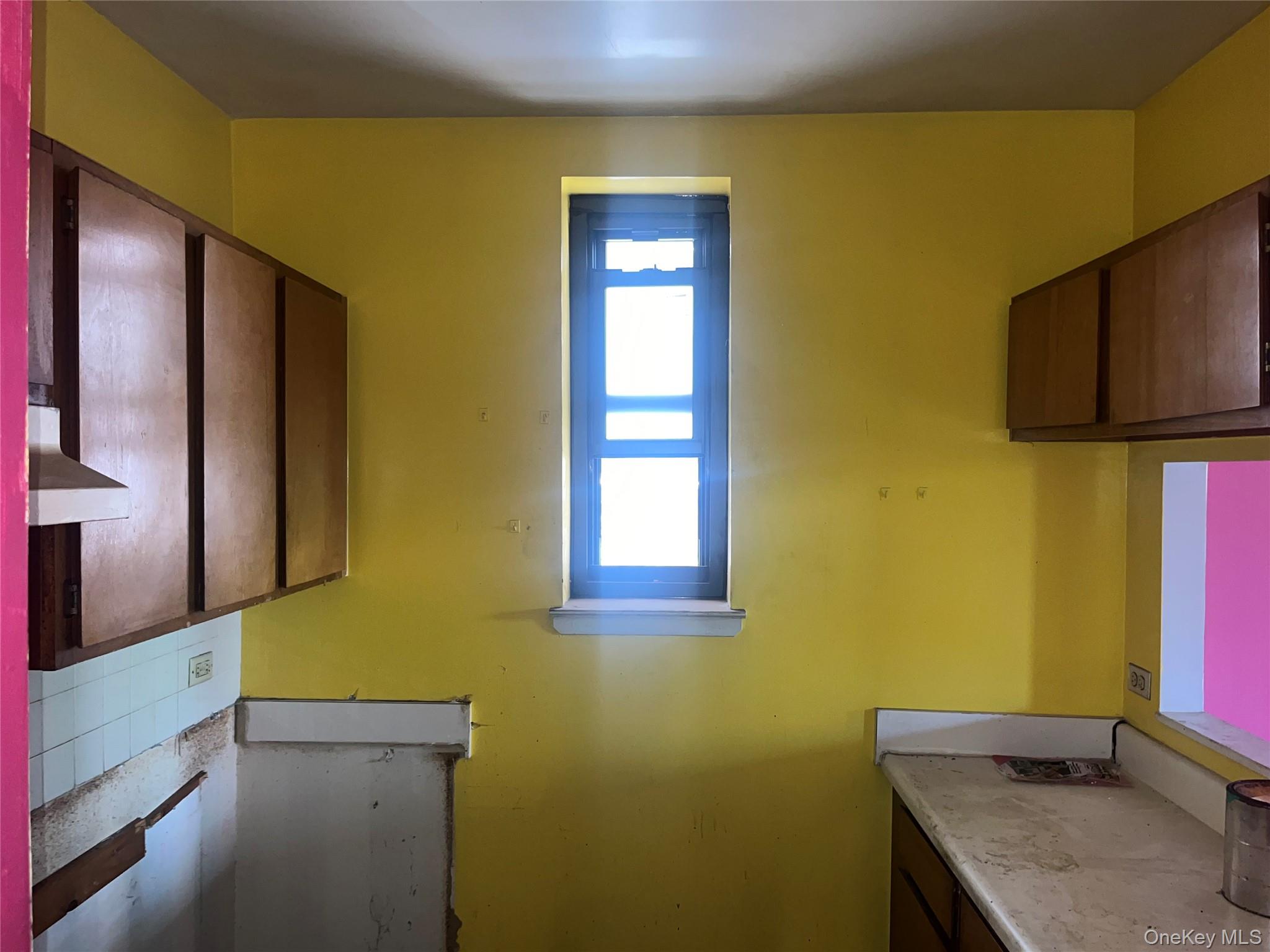 18 East 132nd Street, Unit 3A Manhattan, NY 10037 - Photo 5 of 11 a bathroom with a granite countertop sink and a mirror