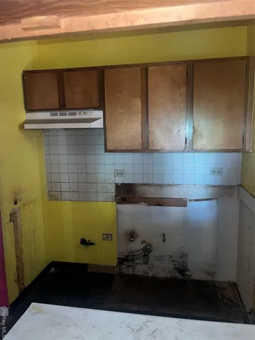 a bathroom with a sink and cabinets