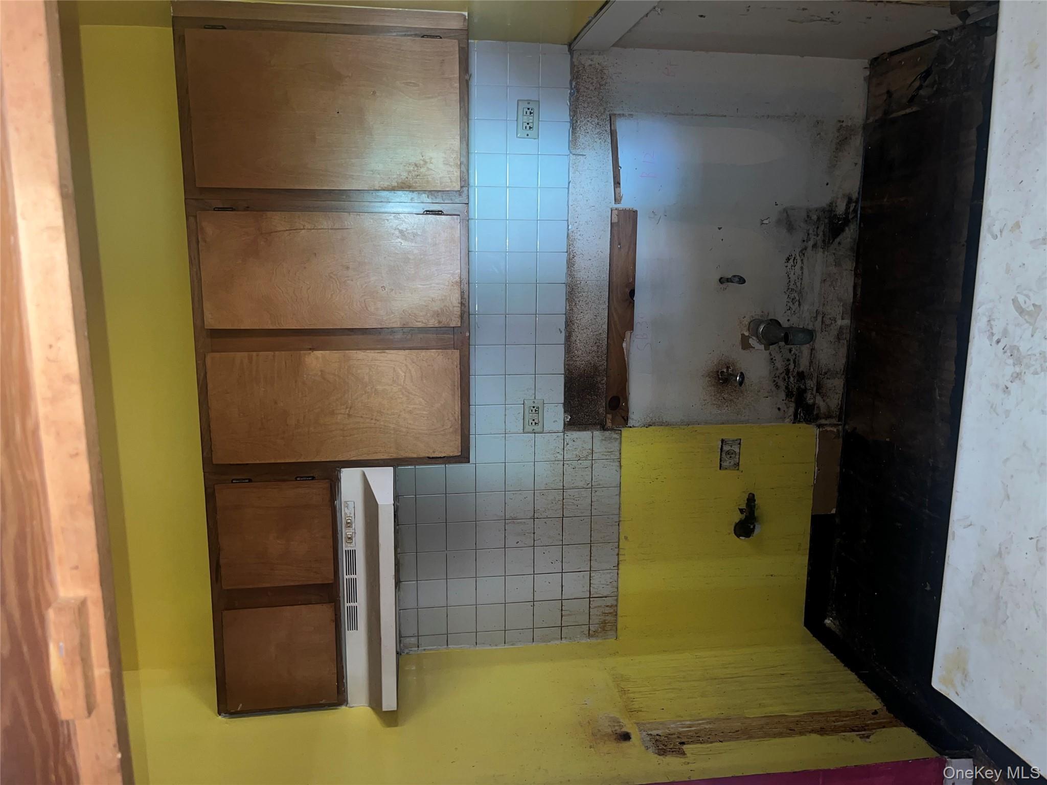 18 East 132nd Street, Unit 3A Manhattan, NY 10037 - Photo 6 of 11 a bathroom with a sink and cabinets