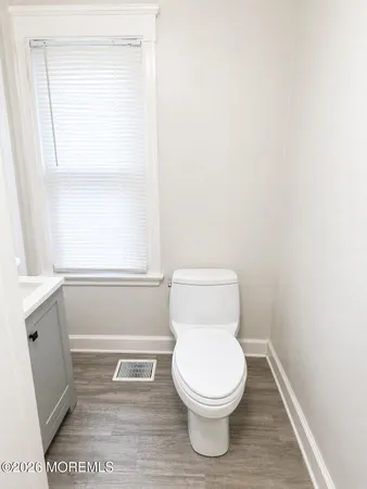 a bathroom with a toilet and a sink