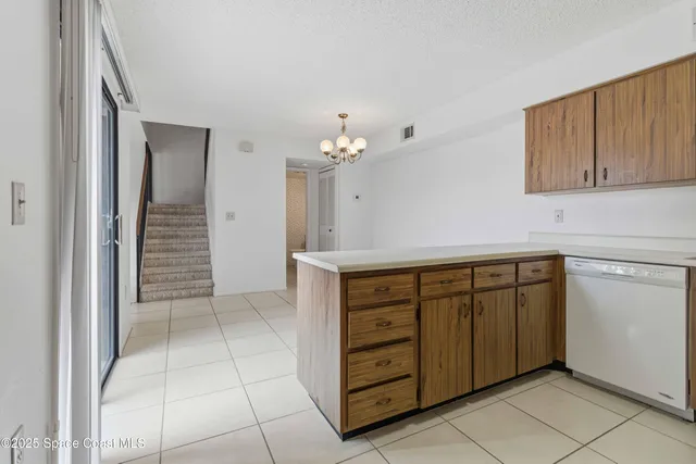 a view of a kitchen with cabinets