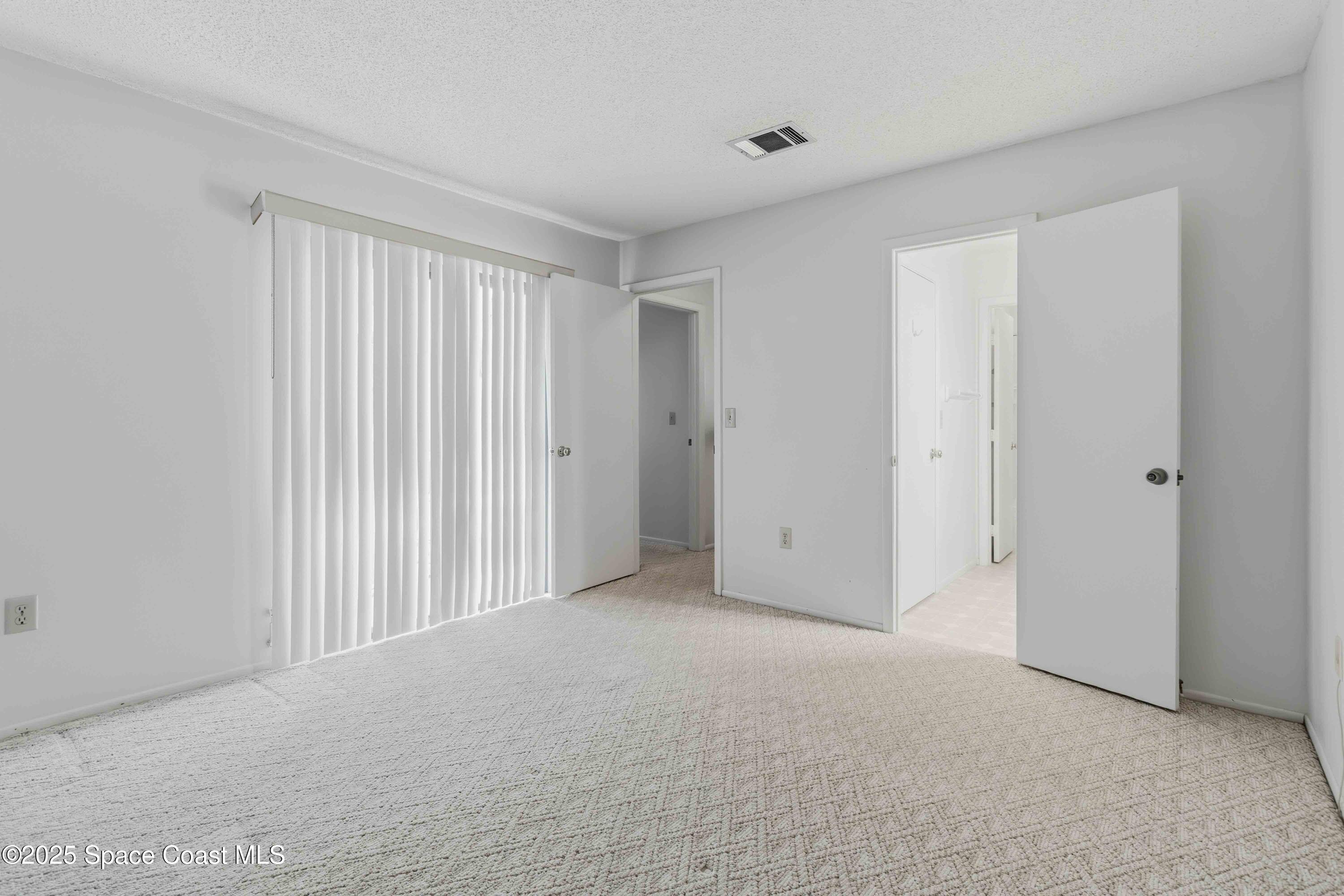 1020 Abada Court Northeast, Unit 103 Palm Bay, FL 32905 - Photo 19 of 26 a view of an empty room and closet area
