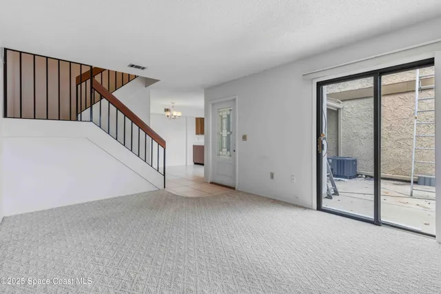 a view of a hallway with staircase