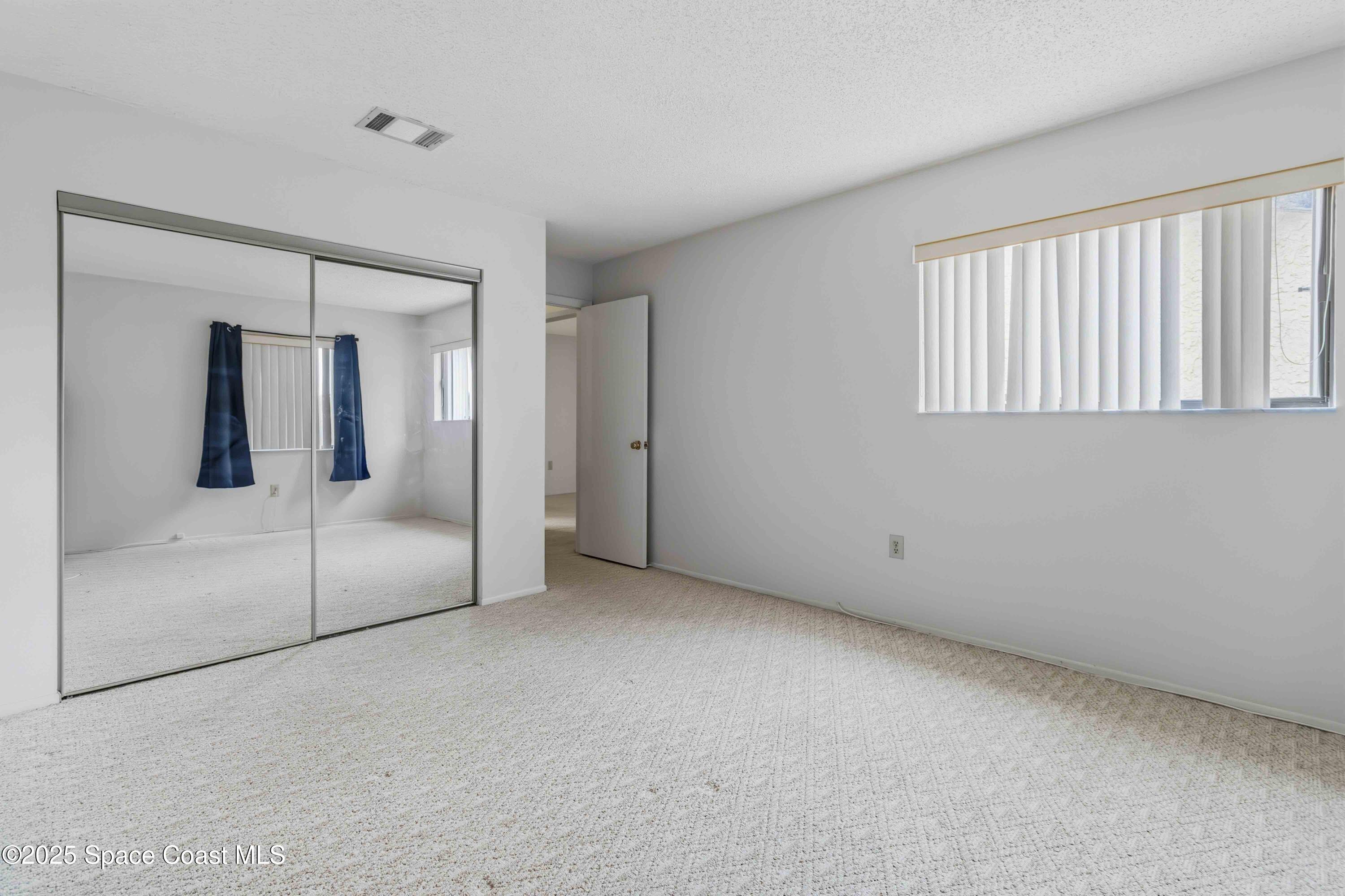 1020 Abada Court Northeast, Unit 103 Palm Bay, FL 32905 - Photo 22 of 26 a view of an empty room
