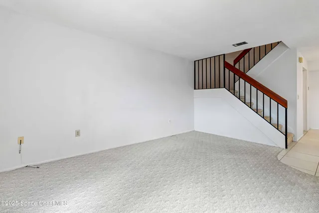 a view of a hallway with stairs