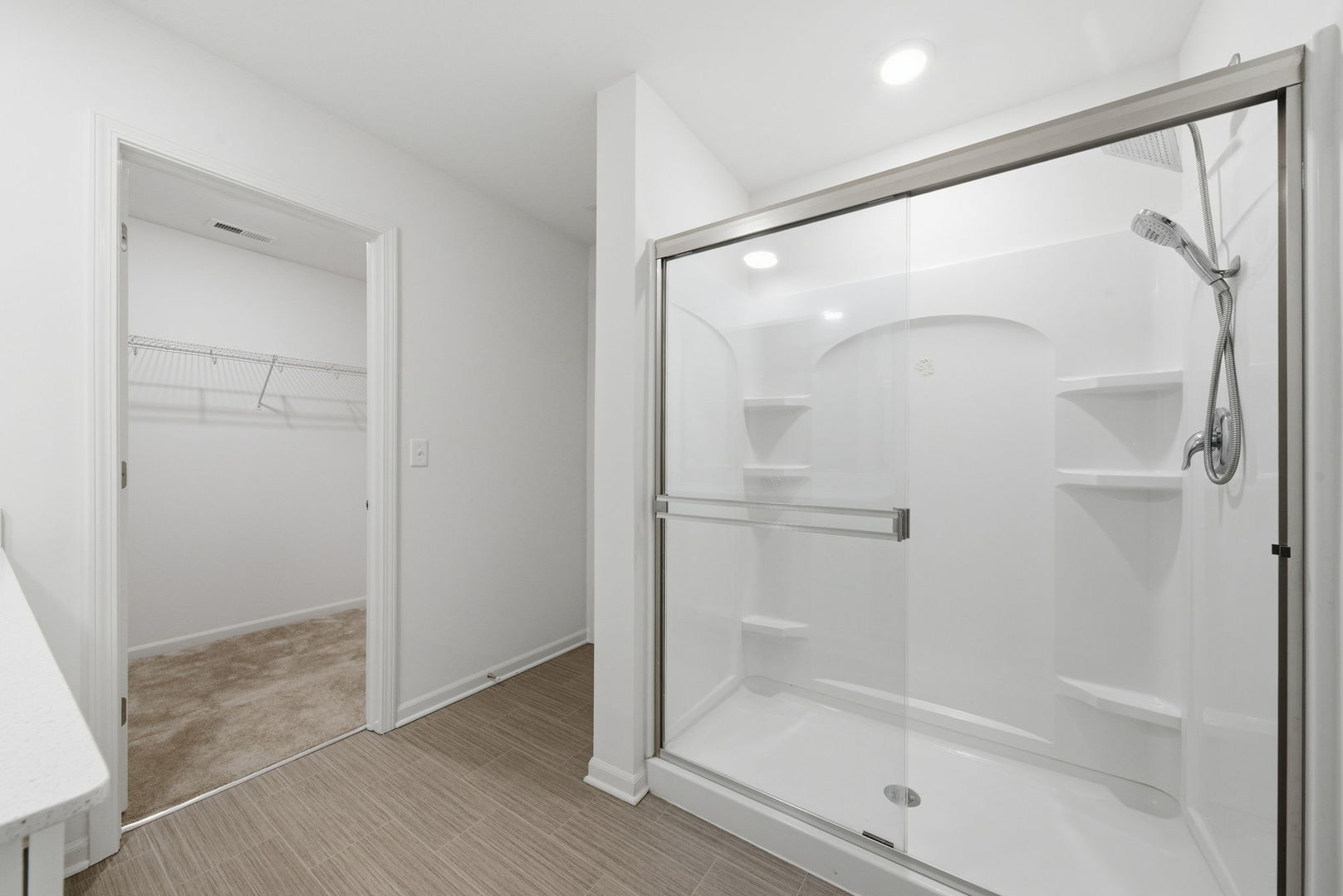 2017 Pembridge Lane Joliet, IL 60431 - Photo 18 of 19 a bathroom with a glass shower door and a glass door