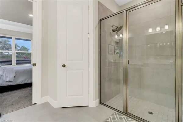 a bathroom with a shower and a sink