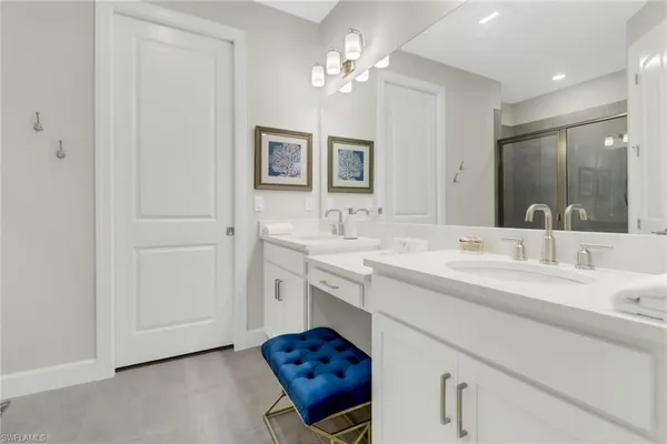 a bathroom with a sink vanity and a mirror