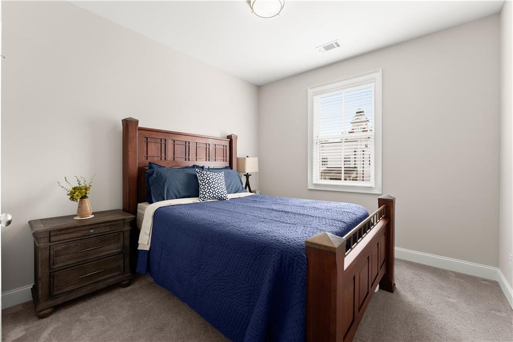 3206 Ridge Towne Place Duluth, GA 30096 - Photo 26 of 42 a bedroom with a bed and a window