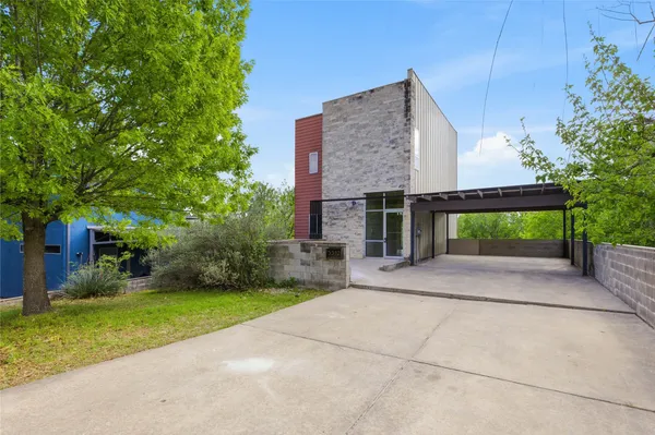 a view of a house with a yard and garage