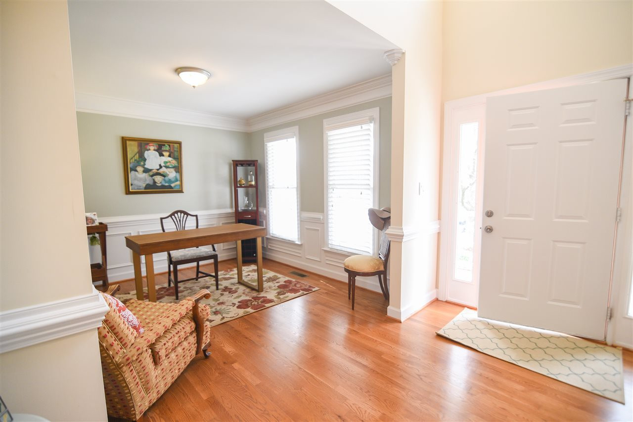 Natural light spills over the gleaming hardwood floors! Foyer