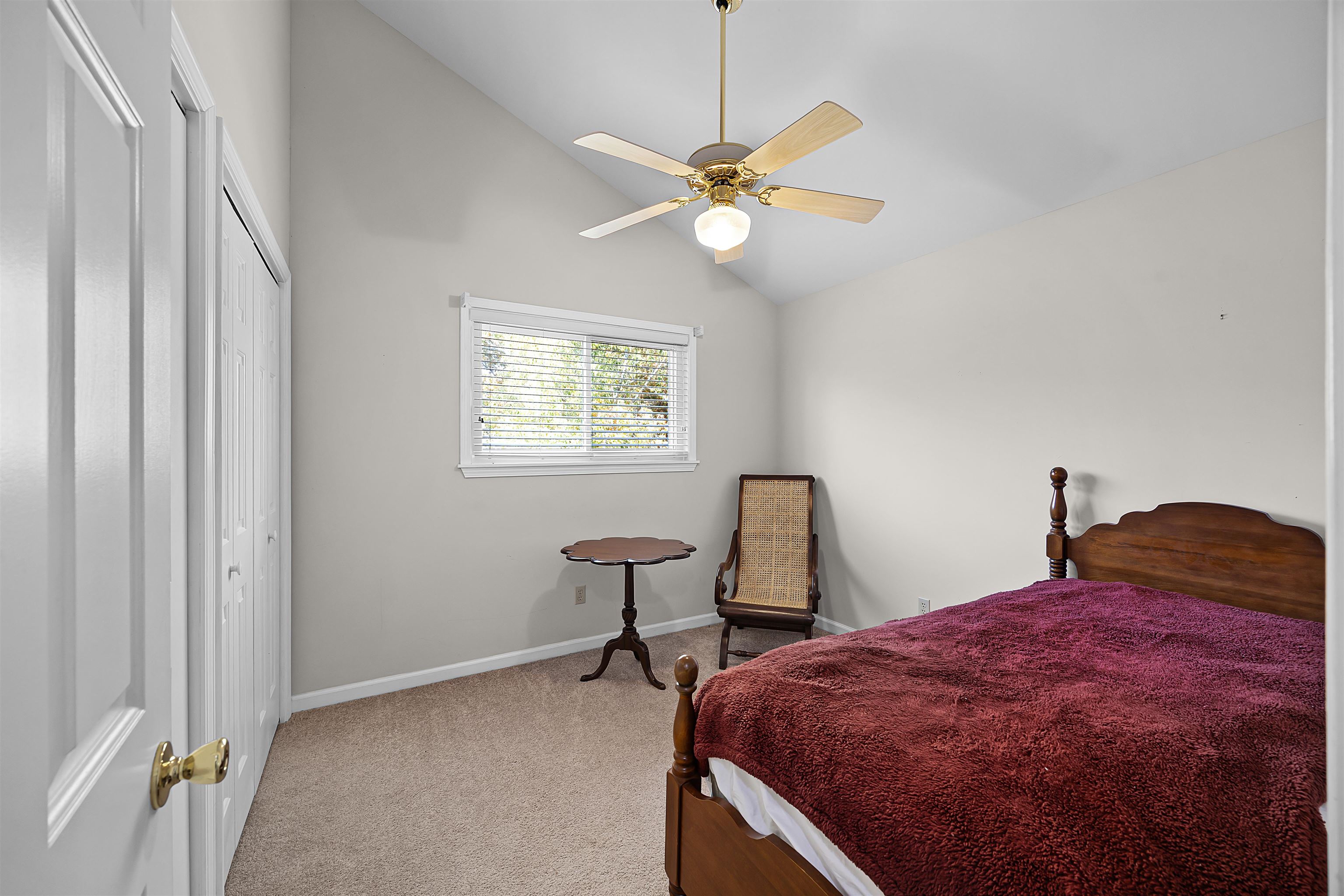 80 Riviera Cove Cherokee, AL 35616 - Photo 16 of 31 Carpeted bedroom with a ceiling fan, a closet, and high vaulted ceiling