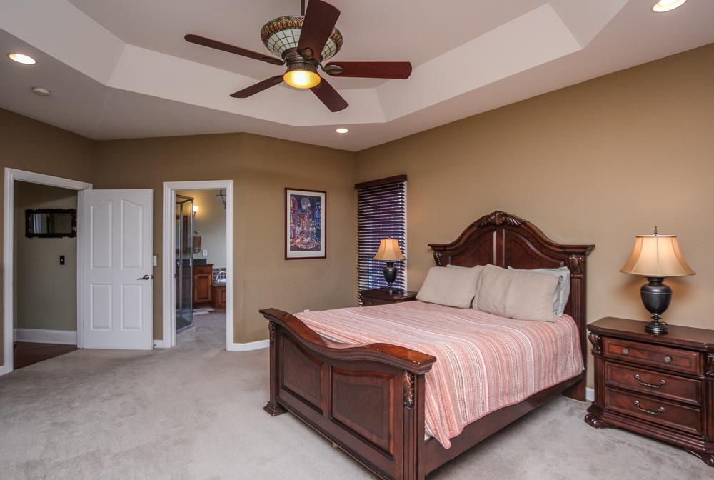 2619 Cooks Road Mount Juliet, TN 37122 - Photo 15 of 30 a bedroom with a bed and a chandelier