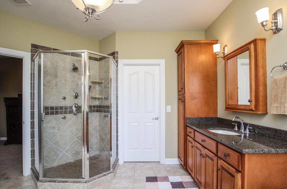2619 Cooks Road Mount Juliet, TN 37122 - Photo 17 of 30 a bathroom with a granite countertop shower mirror and a sink