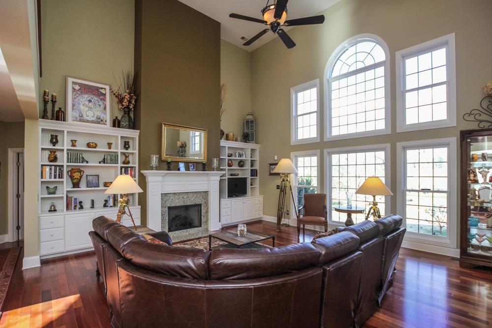 2619 Cooks Road Mount Juliet, TN 37122 - Photo 7 of 30 a living room with furniture a fireplace and a flat screen tv