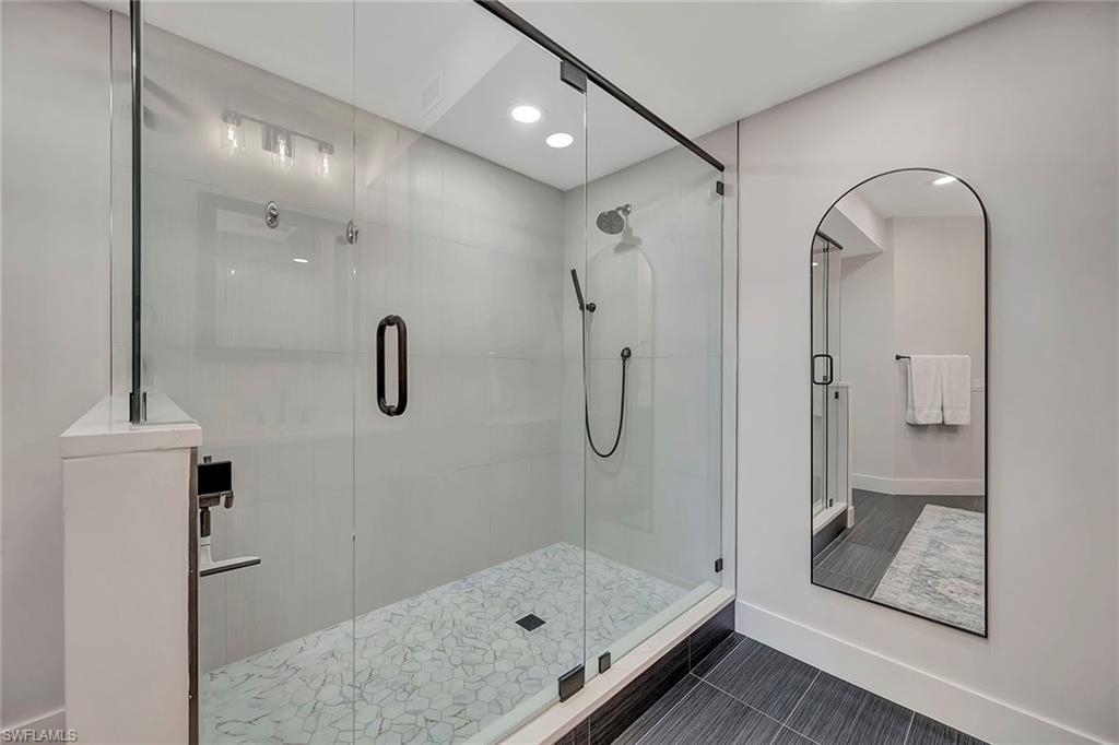 7671 Pebble Creek Circle, Unit 303 Naples, FL 34108 - Photo 19 of 28 Primary Walk-in Shower