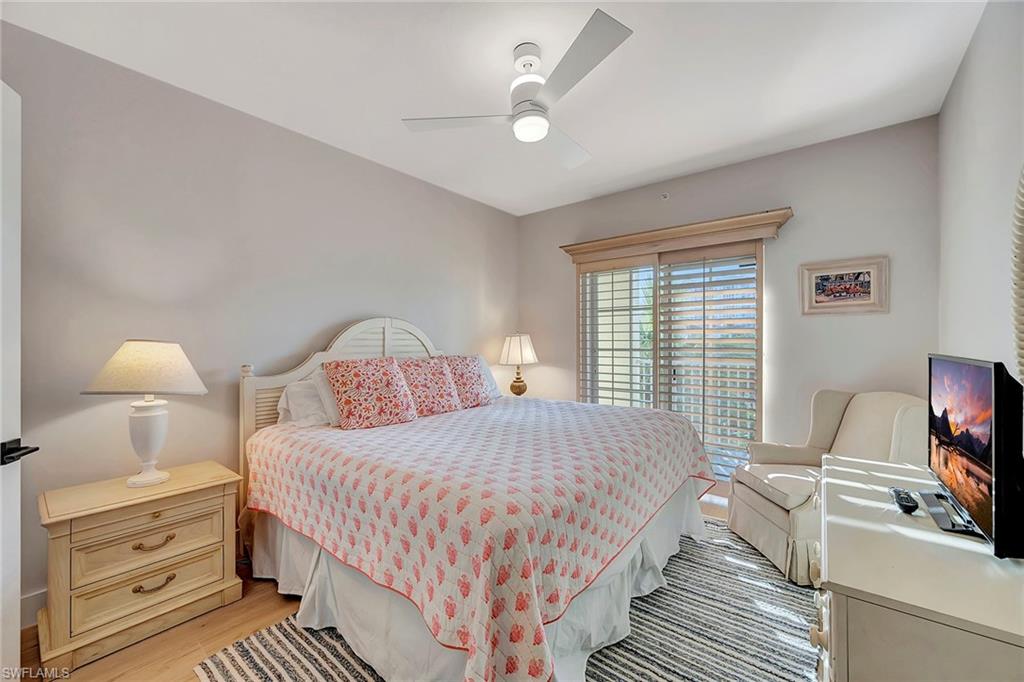 7671 Pebble Creek Circle, Unit 303 Naples, FL 34108 - Photo 21 of 28 Guest Bedroom 1 with King Bed