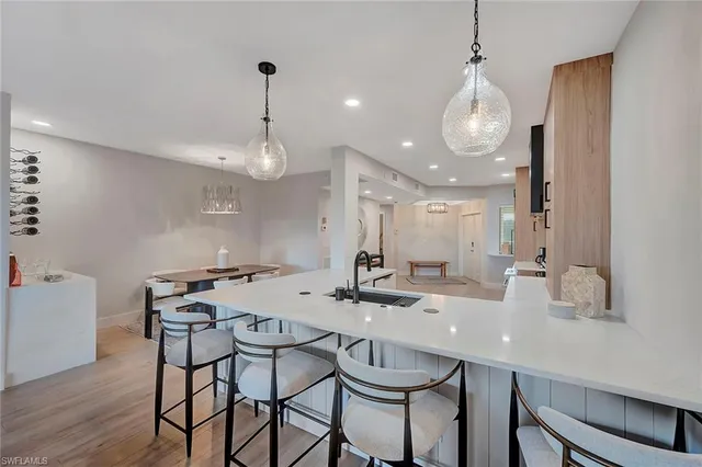 a kitchen with a table and chairs in it