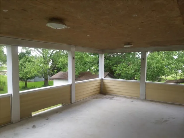 a view of a floor to ceiling window and a yard
