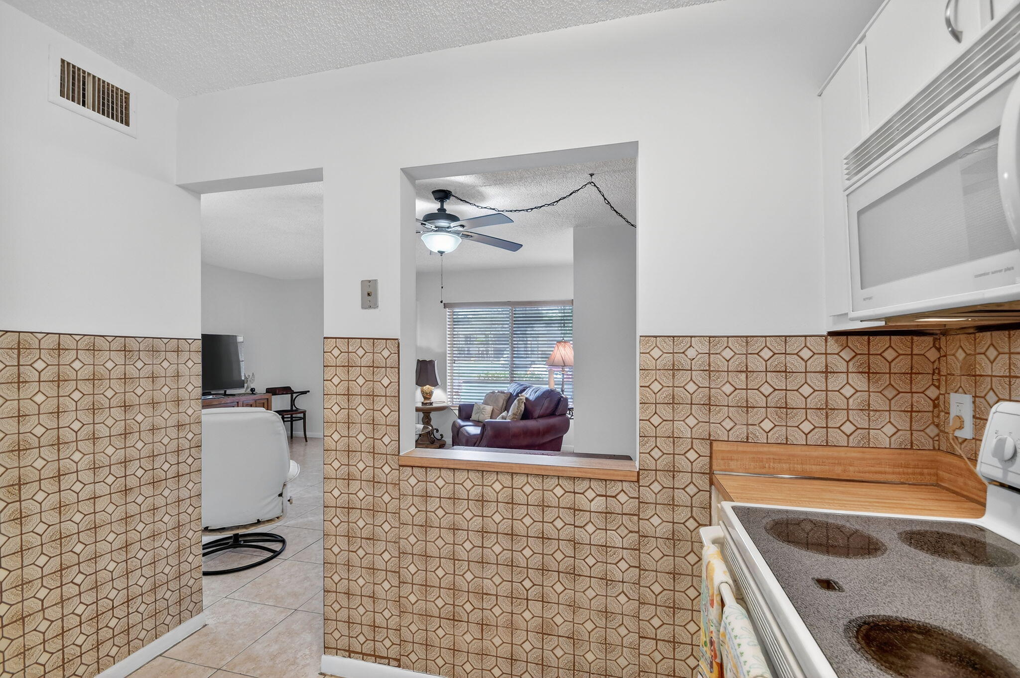 342 Pine Ridge Circle, Unit D1 Greenacres, FL 33463 - Photo 11 of 24 a bathroom with a sink a mirror and shower