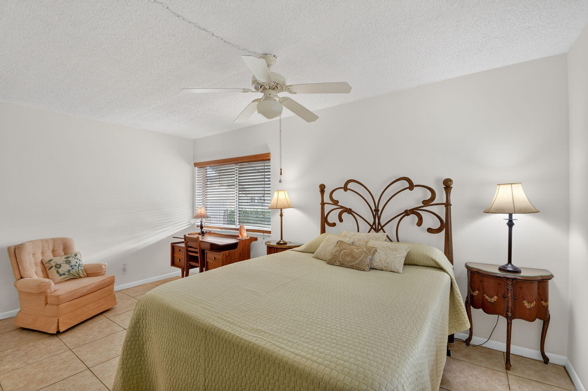 342 Pine Ridge Circle, Unit D1 Greenacres, FL 33463 - Photo 14 of 24 a bedroom with a bed and a couch