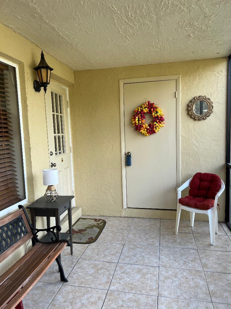342 Pine Ridge Circle, Unit D1 Greenacres, FL 33463 - Photo 3 of 24 a room with furniture and rug
