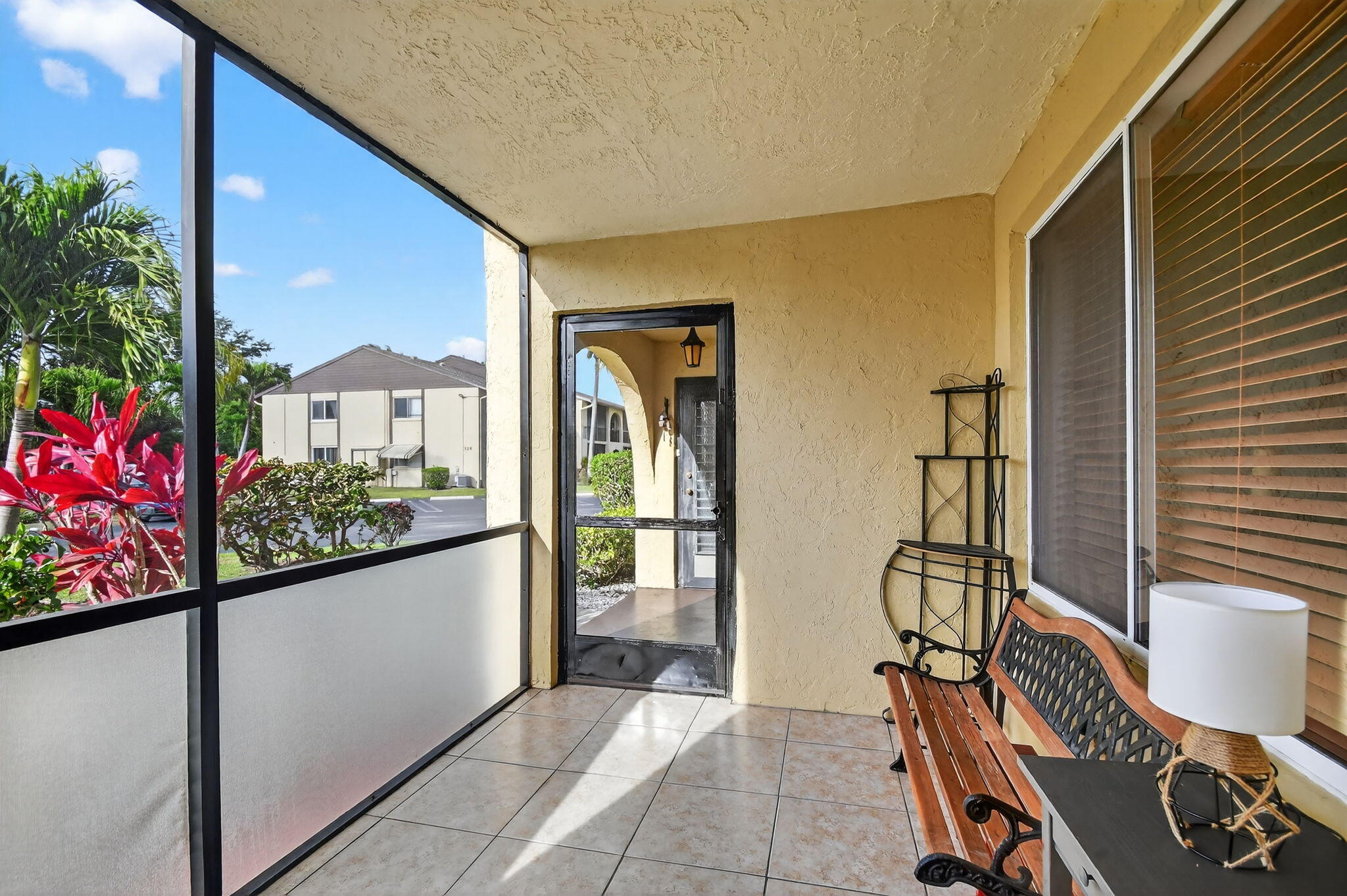342 Pine Ridge Circle, Unit D1 Greenacres, FL 33463 - Photo 4 of 24 a view of a chairs and table in a balcony