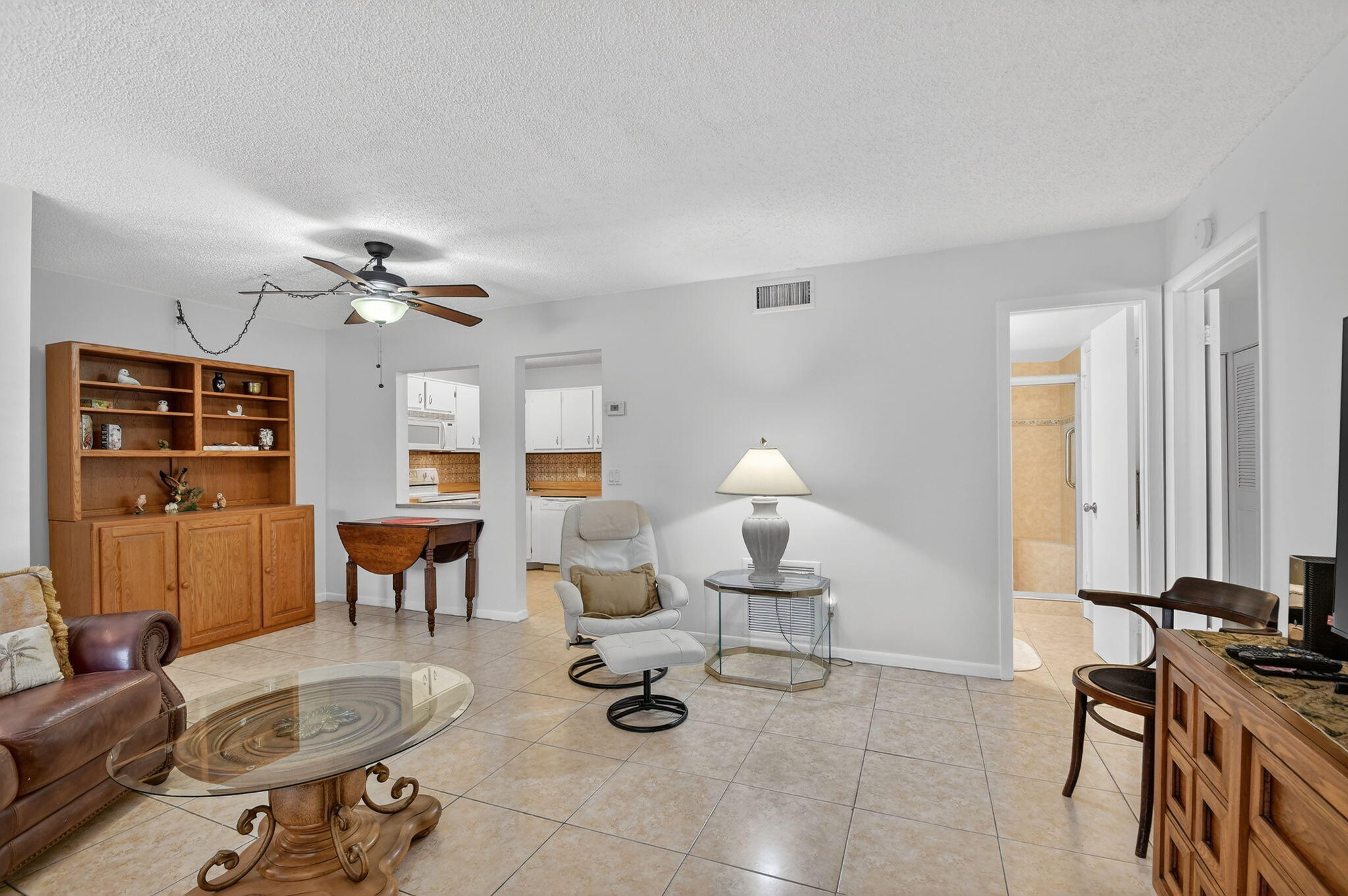 342 Pine Ridge Circle, Unit D1 Greenacres, FL 33463 - Photo 7 of 24 a view of a livingroom with furniture and a table