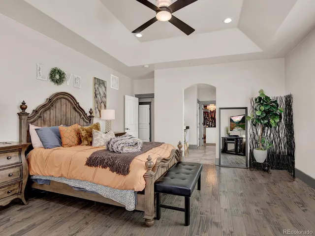 a spacious bathroom with a sink a mirror and bathtub