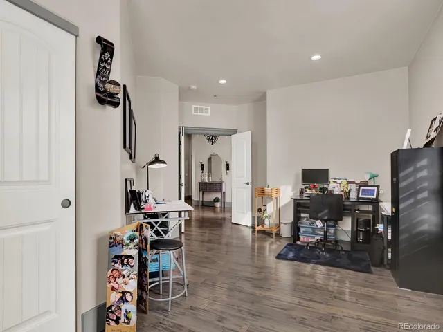 a bathroom with cabinets and mirror