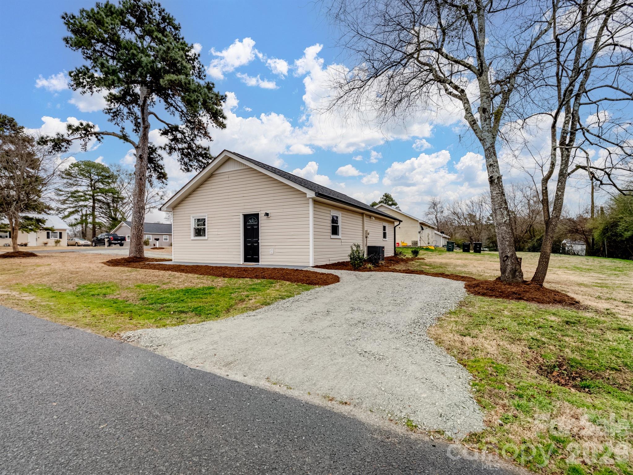 307 Jones Street Monroe, NC 28110 - Photo 2 of 22 a view of a house with snow on the road