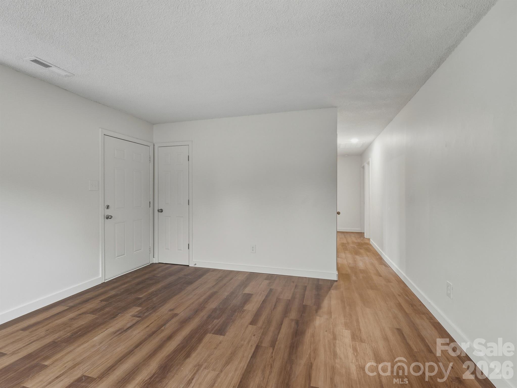 307 Jones Street Monroe, NC 28110 - Photo 9 of 22 a view of a room with wooden floor