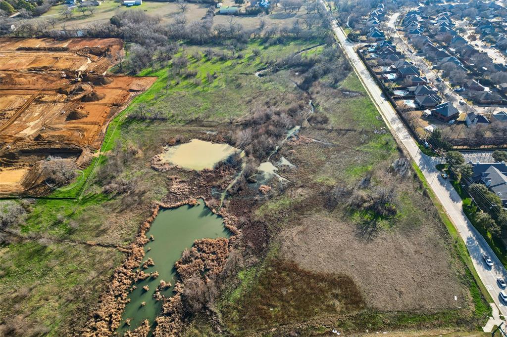 5400 Long Prairie Road Flower Mound, TX 75028 - Photo 12 of 14 a view of a lake in the background