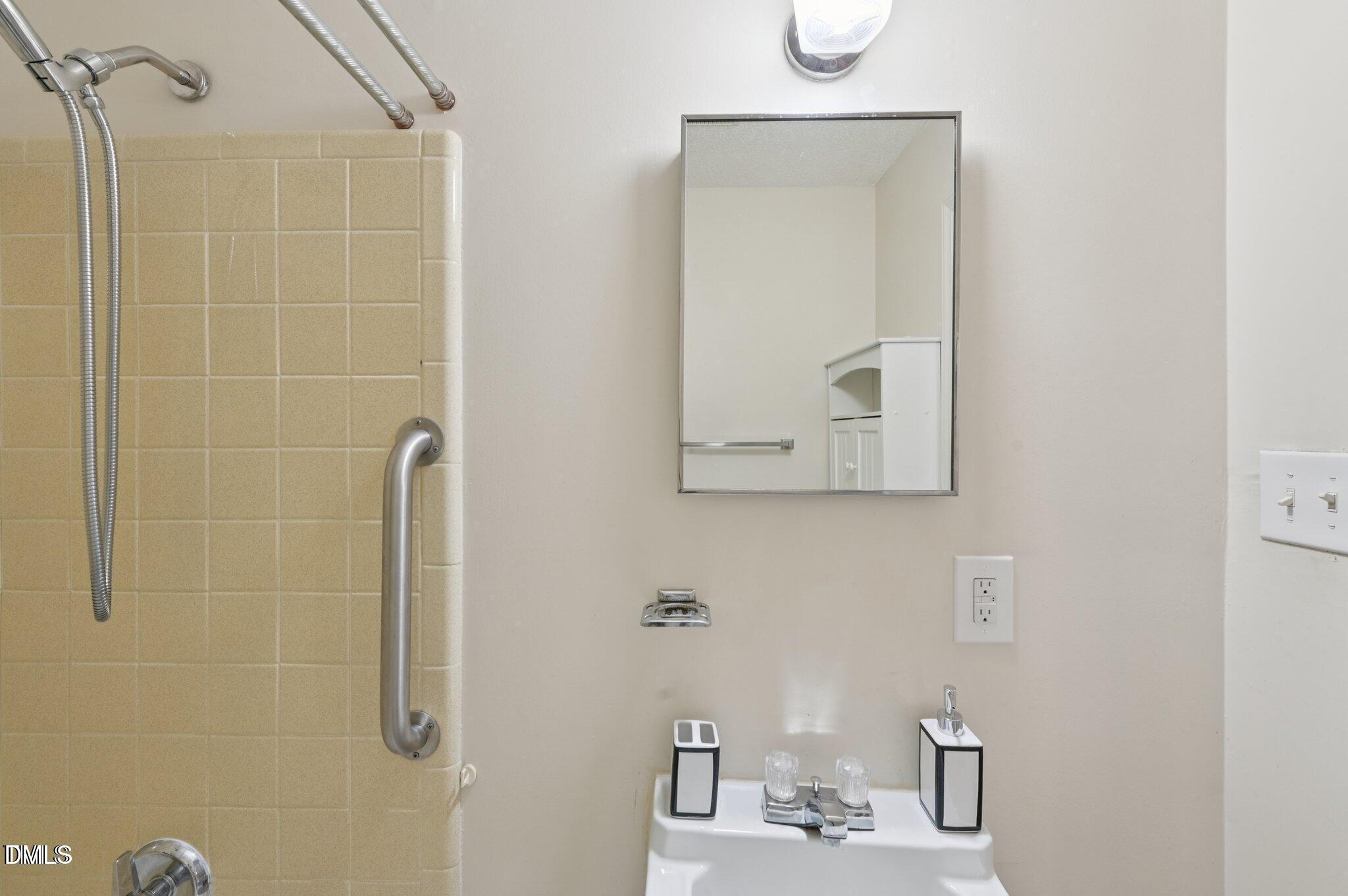 555 Dacian Road Raleigh, NC 27610 - Photo 15 of 16 a bathroom with a shower