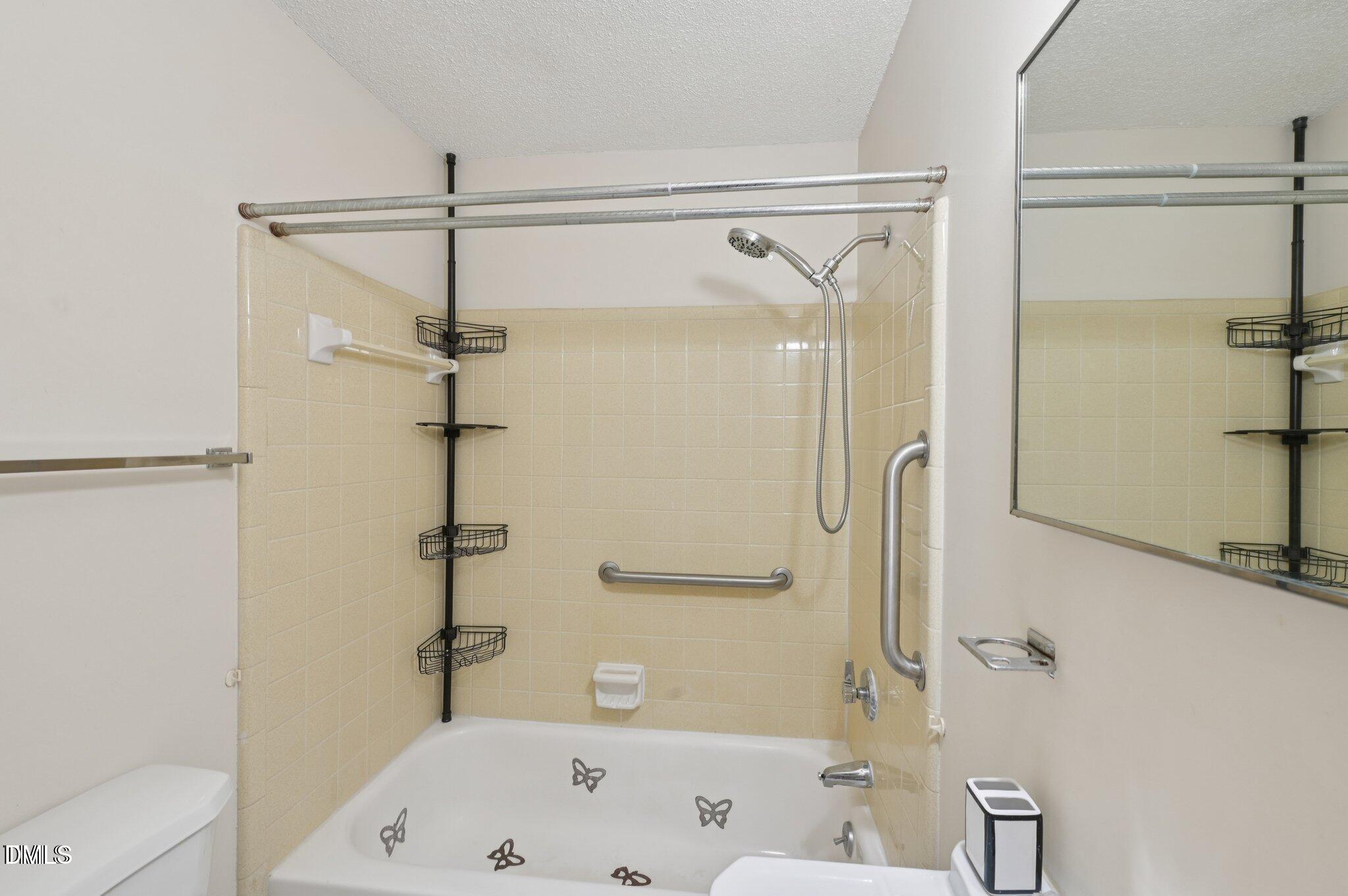 555 Dacian Road Raleigh, NC 27610 - Photo 16 of 16 a bathroom with a bath tub with a shower