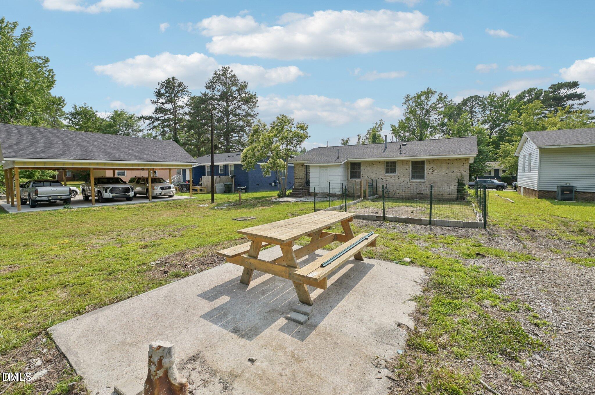 555 Dacian Road Raleigh, NC 27610 - Photo 3 of 16 a view of a house with swimming pool and sitting area