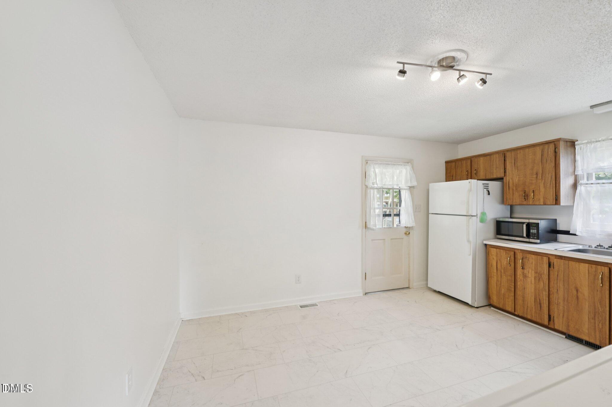 555 Dacian Road Raleigh, NC 27610 - Photo 7 of 16 a view of a kitchen with a sink