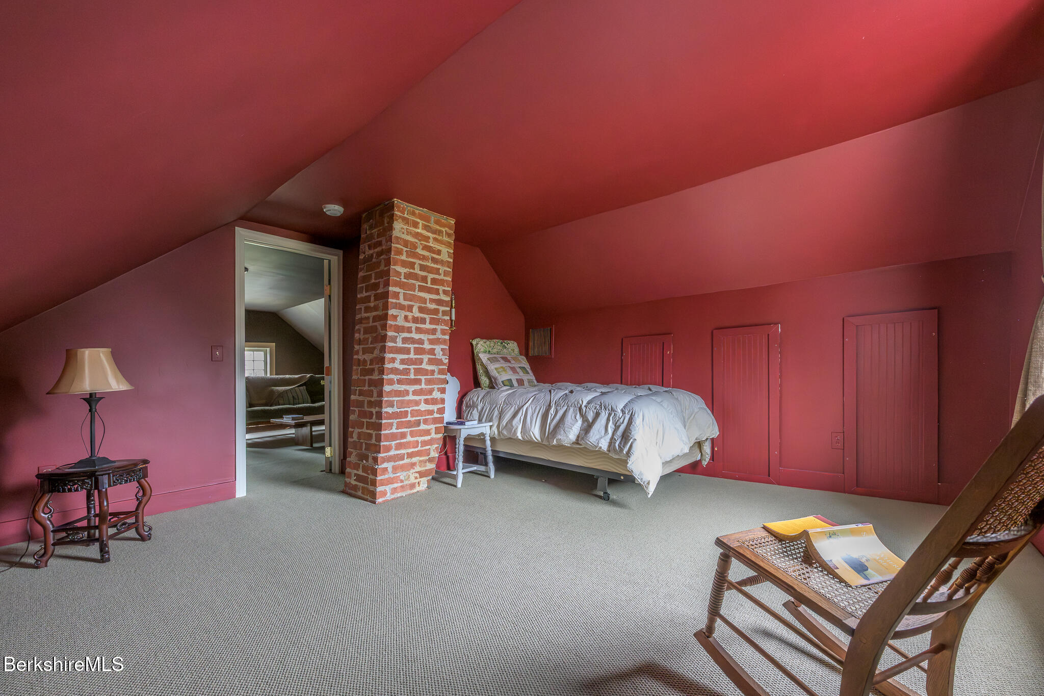 11 Sergeant Street Stockbridge, MA 01262 - Photo 39 of 52 a bedroom with a bed and a lamp with wooden floor